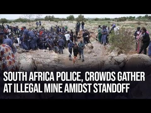 South Africa Police, Crowds Gather at Illegal Mine Amid Tense Standoff”